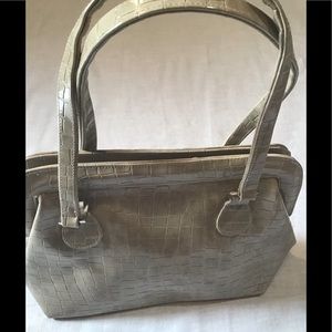 Women’s purse / handbag . One inside pocket and zipper closure.